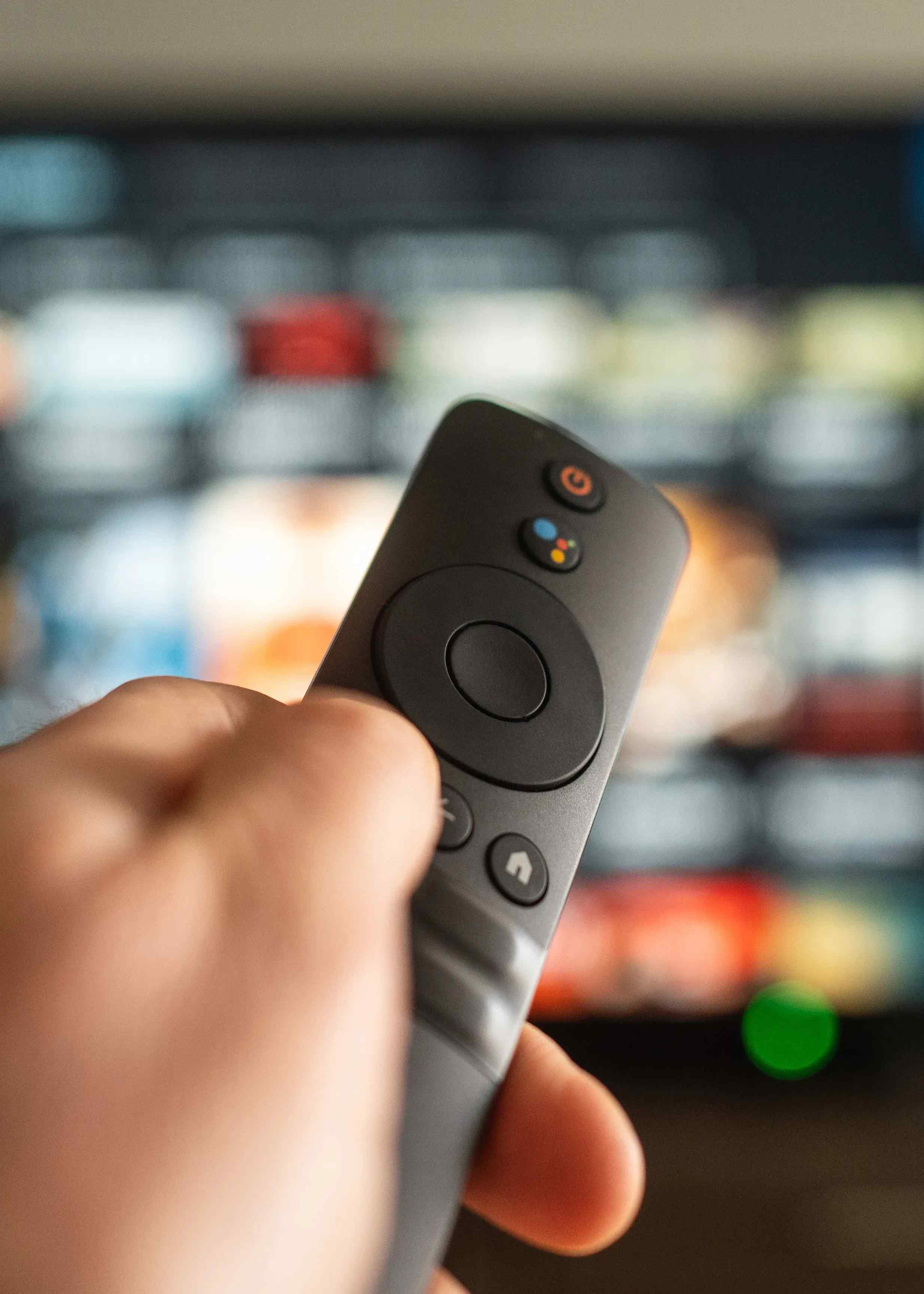smart tv remote in hand