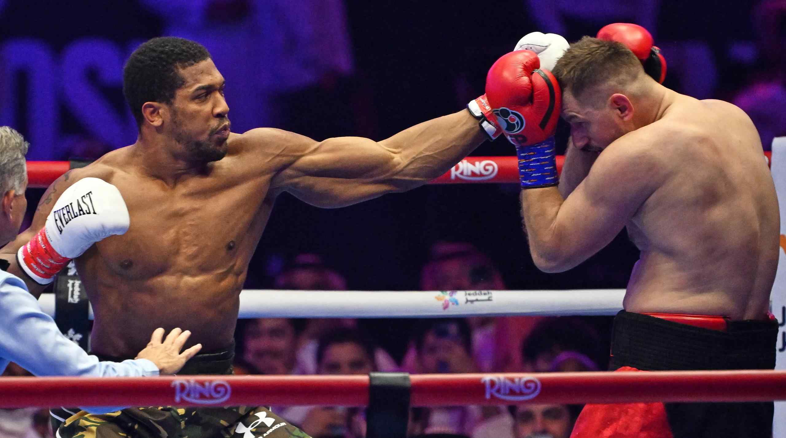Anthony Joshua throwing a punch in the midst of a match.