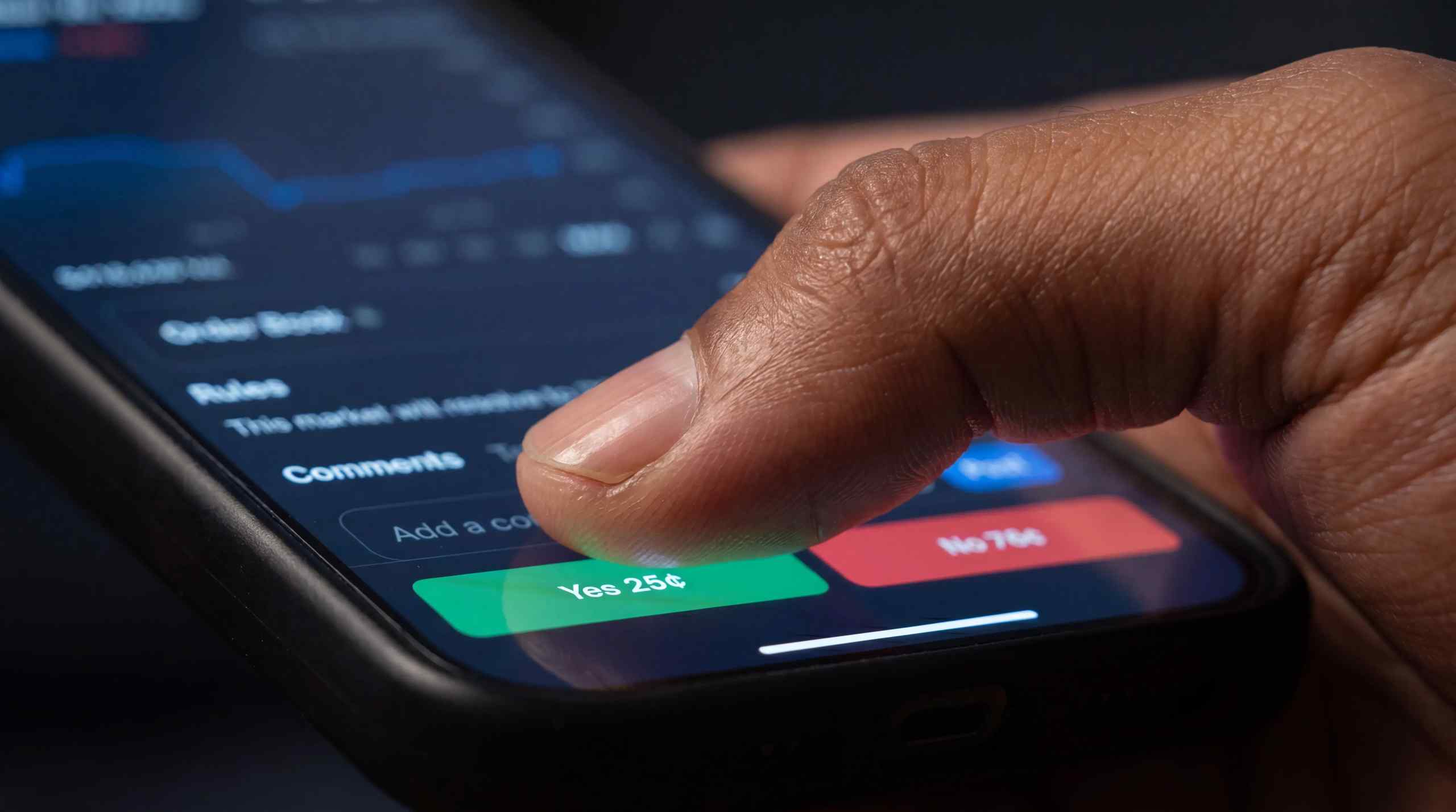 A smartphone running the Polymarket app displayed on the screen.