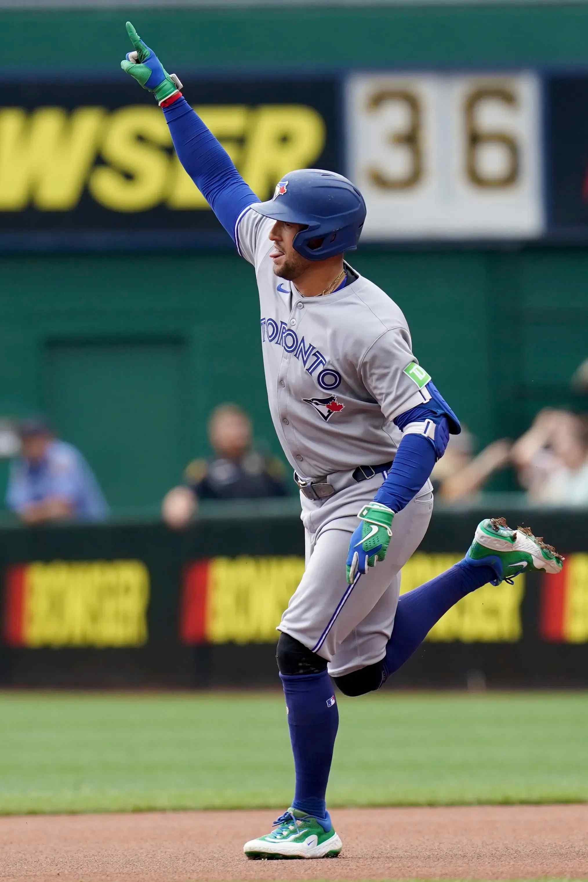 A Toronto Blue Jays player runs the basis.