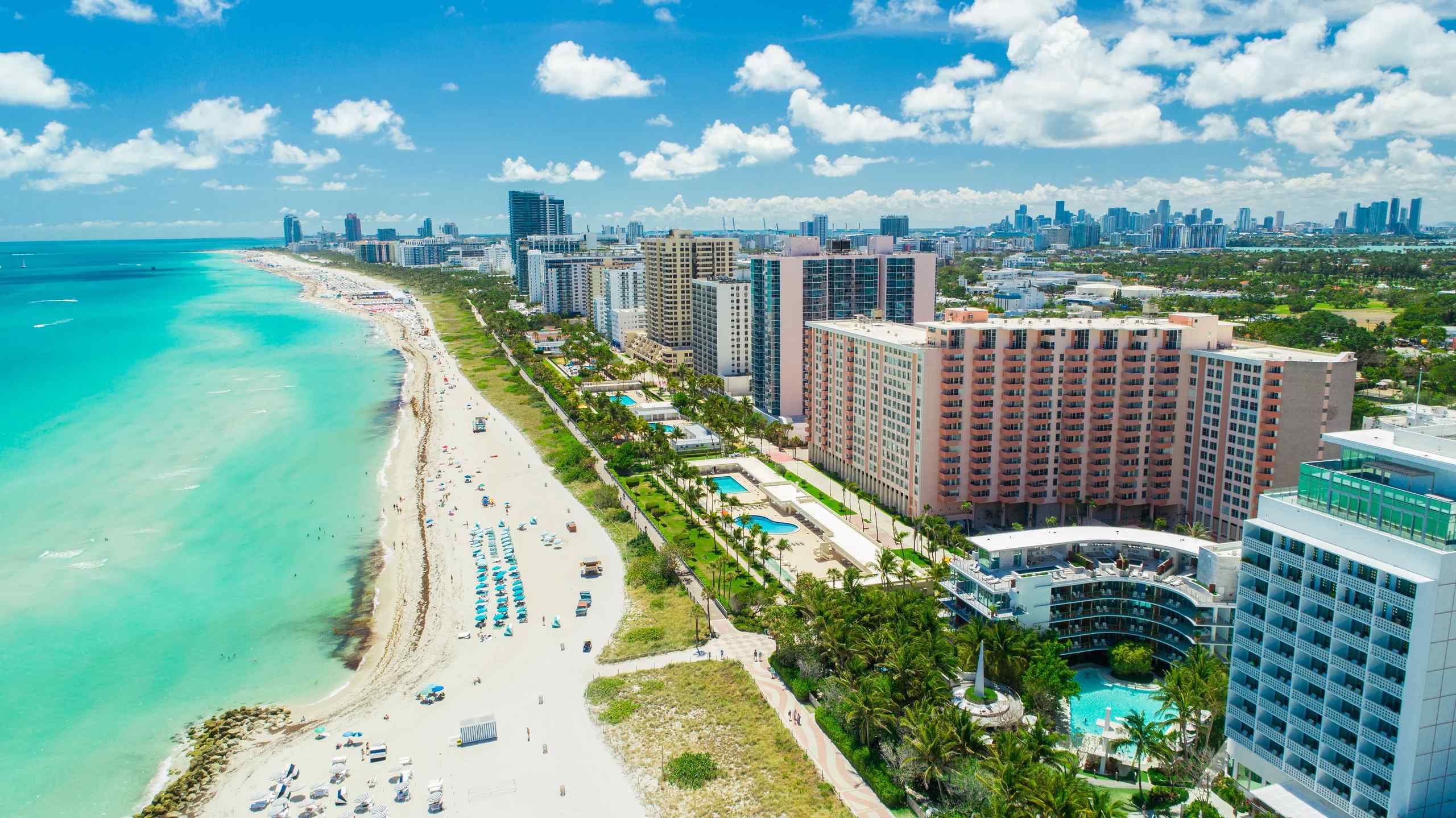 A sunny beach with people on vacation.