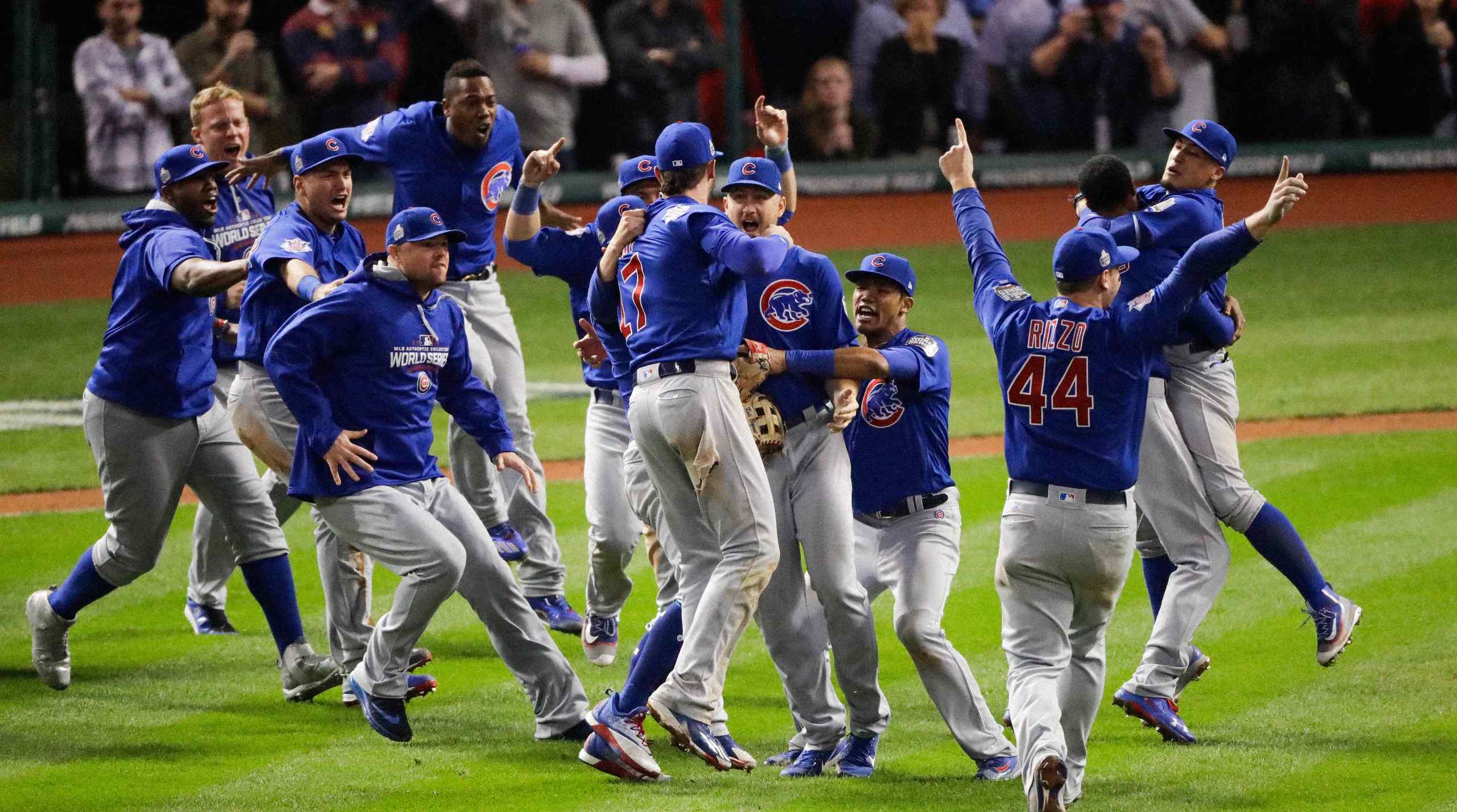 The Chicago Cubs celebrate on the field after defeating the Cleveland Indians 8–7 in 10 innings during Game 7 of the 2016 World Series.