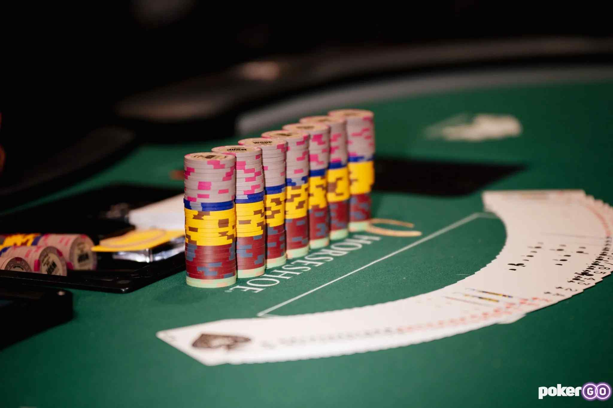 Chips and cards on a poker table.