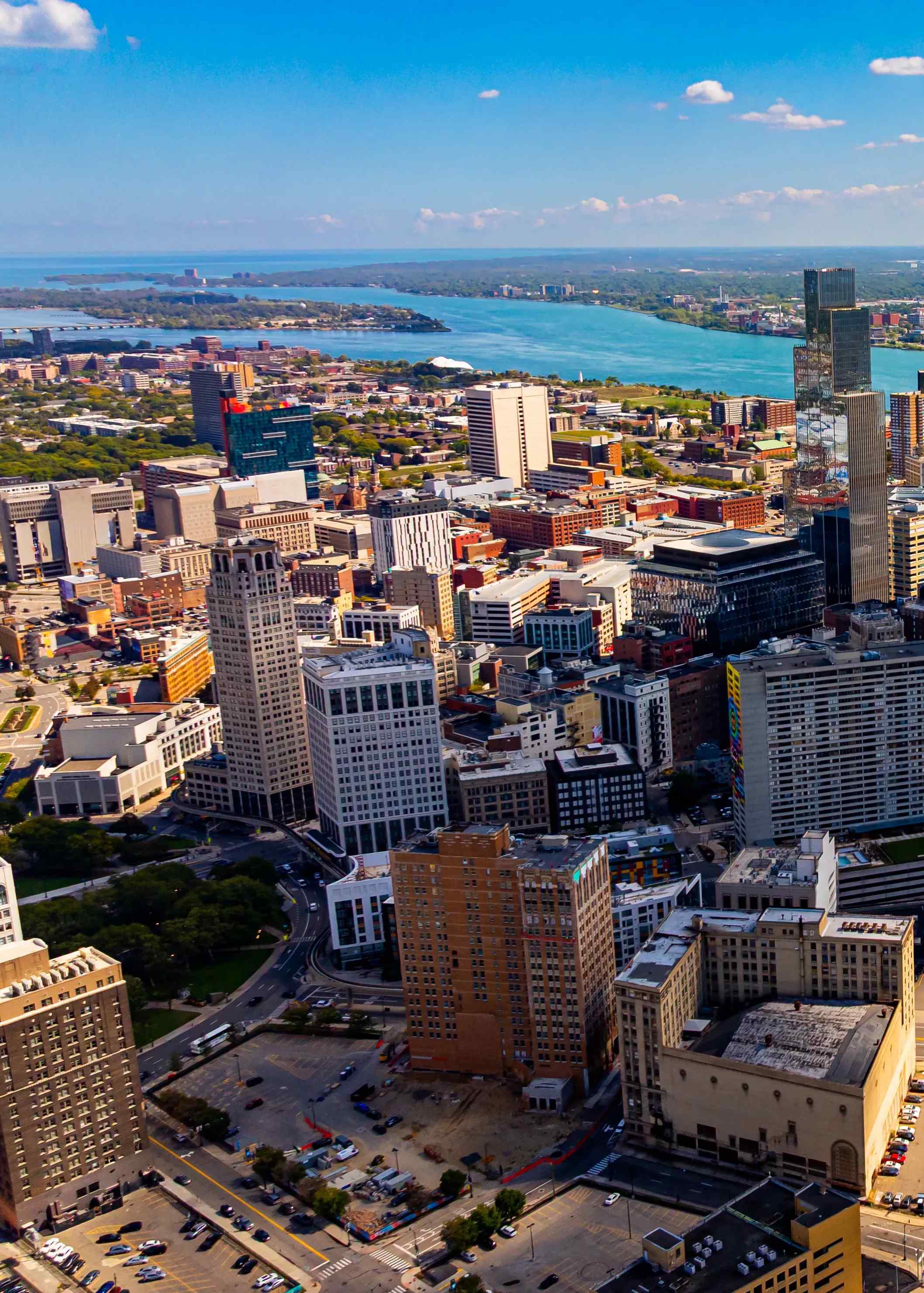 An aerial view showing the downtown skyline and waterfront of Detroit, Michigan.
