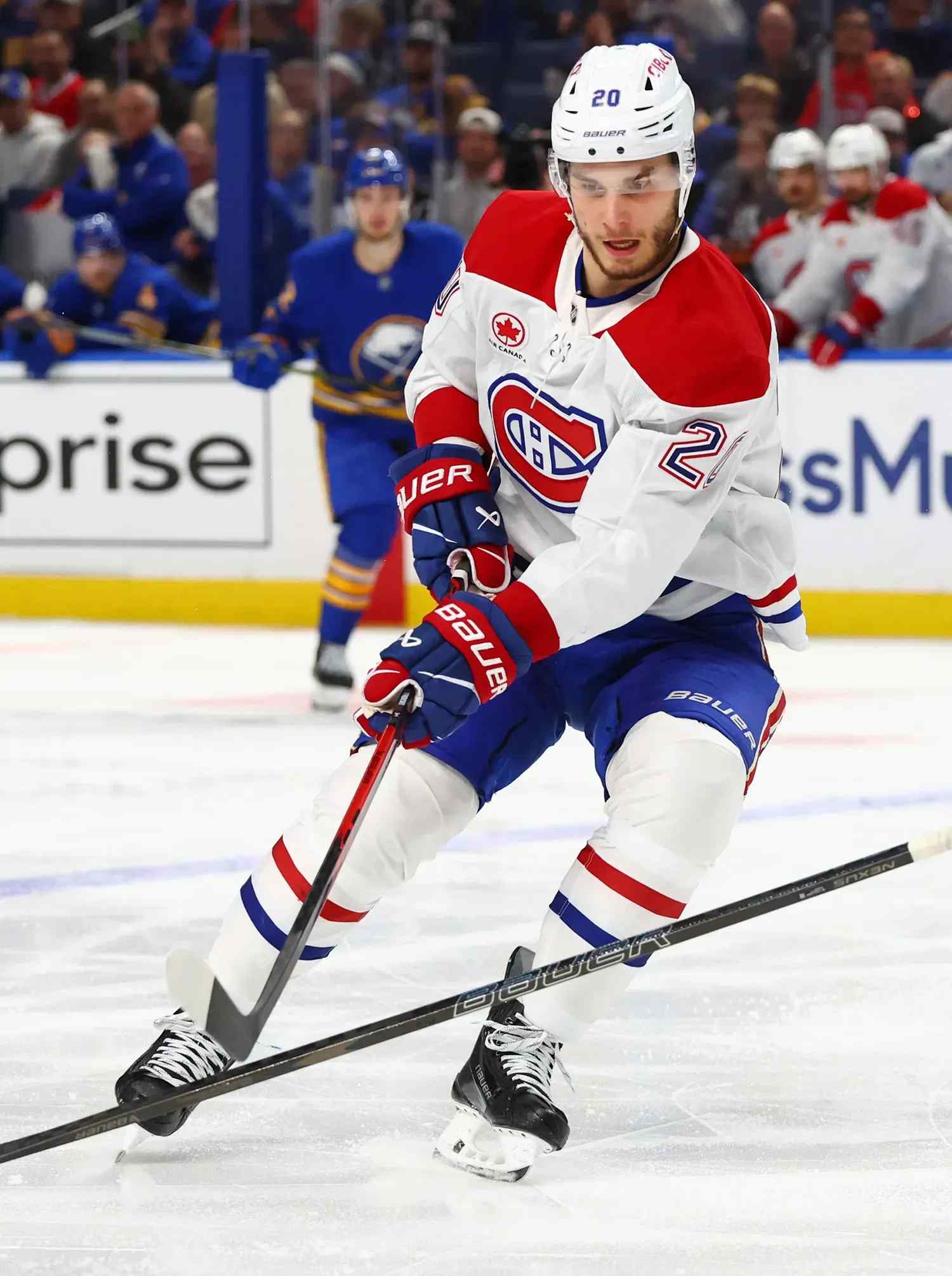 canadiens player dodging defender