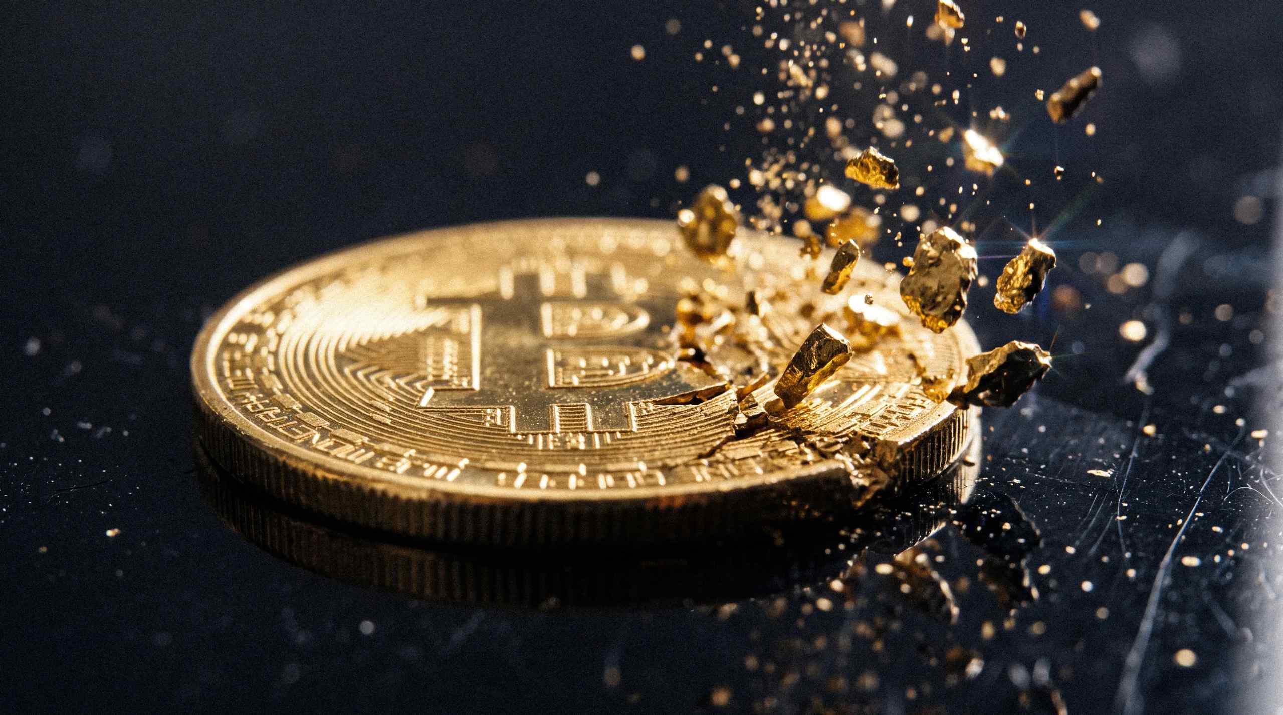 An illustration of a figurative Bitcoin disintegrating.