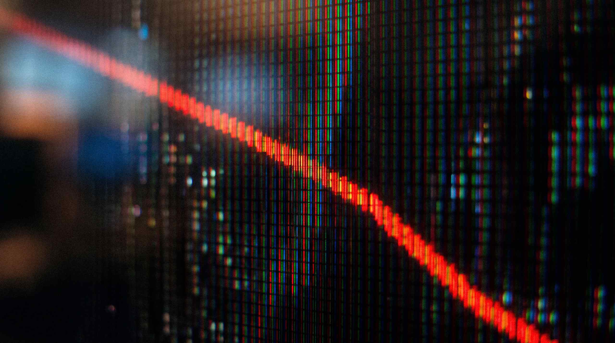A red line descending down a piece of technology.