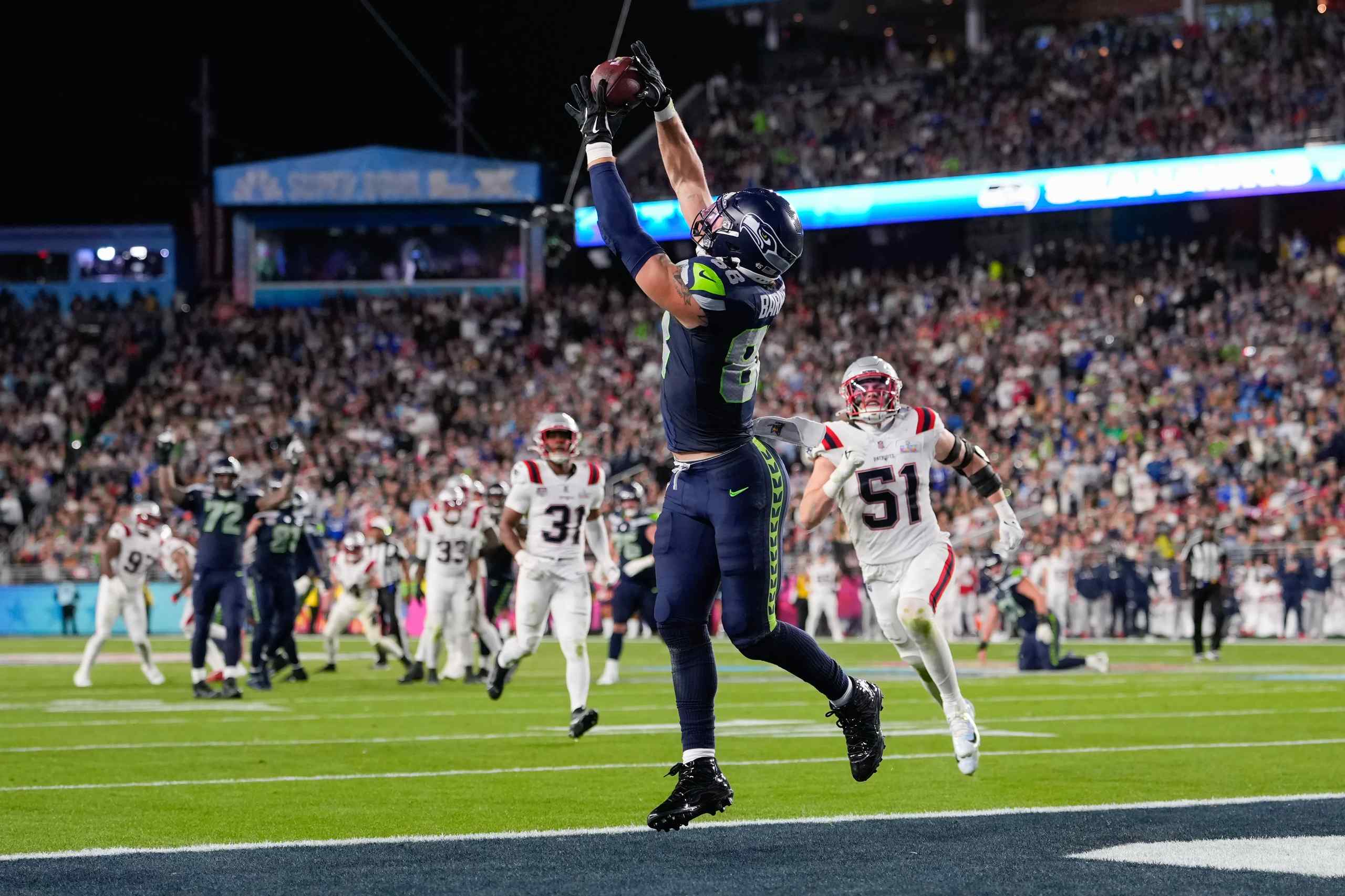 A Seattle Seahawks player makes a catch during an NFL game.