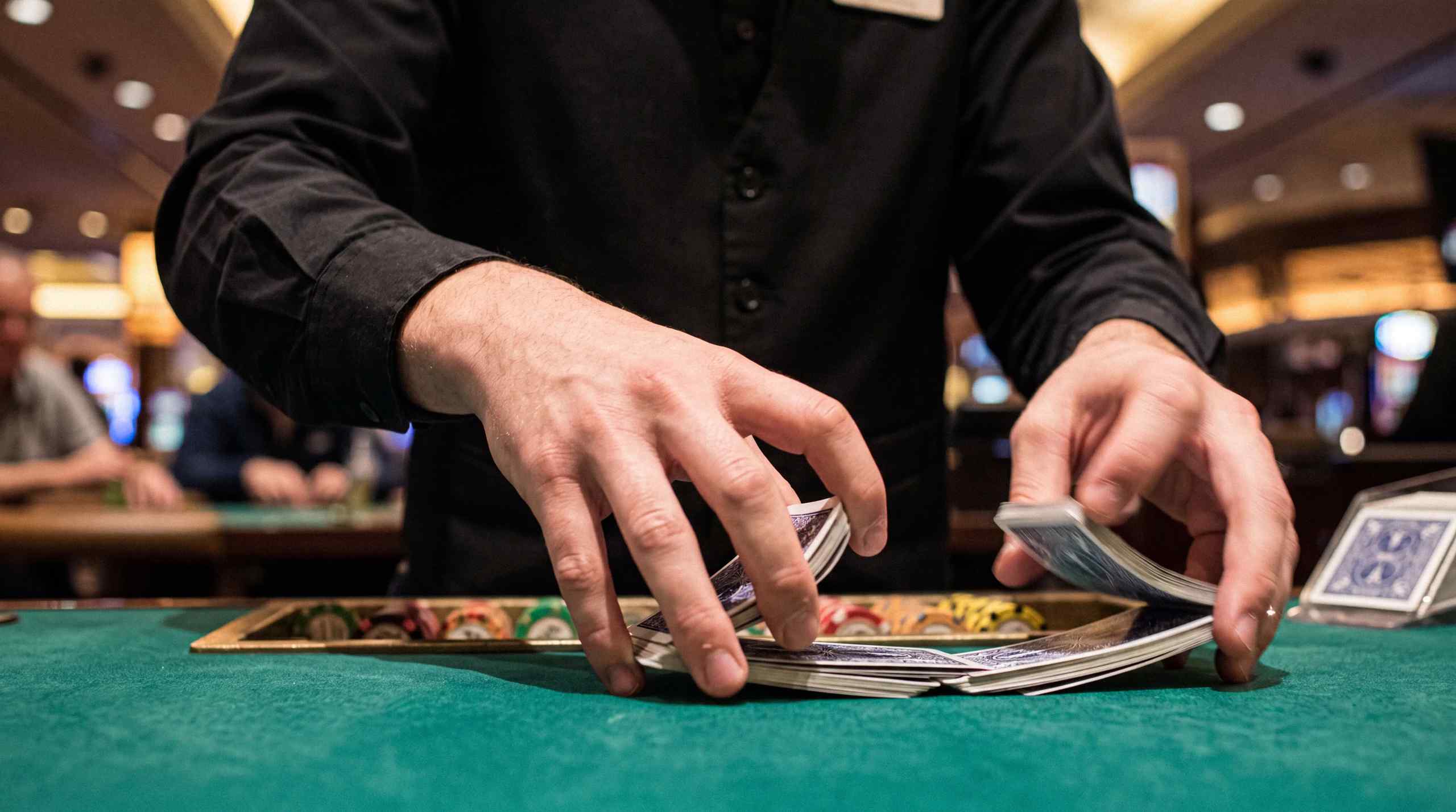 AI image of a casino dealer shuffling cards at a casino.