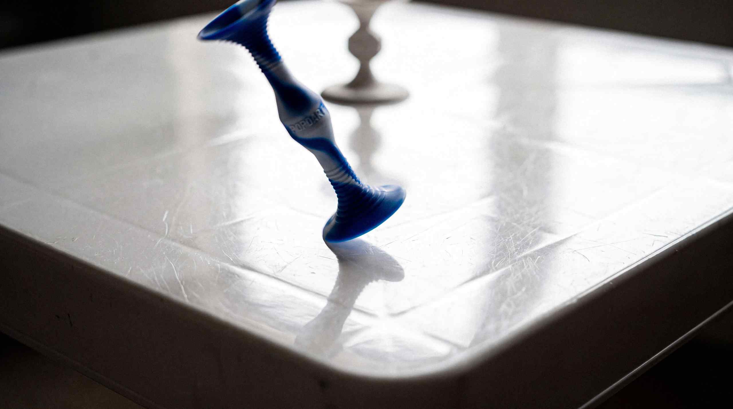 Popdarts sticking to a surface.