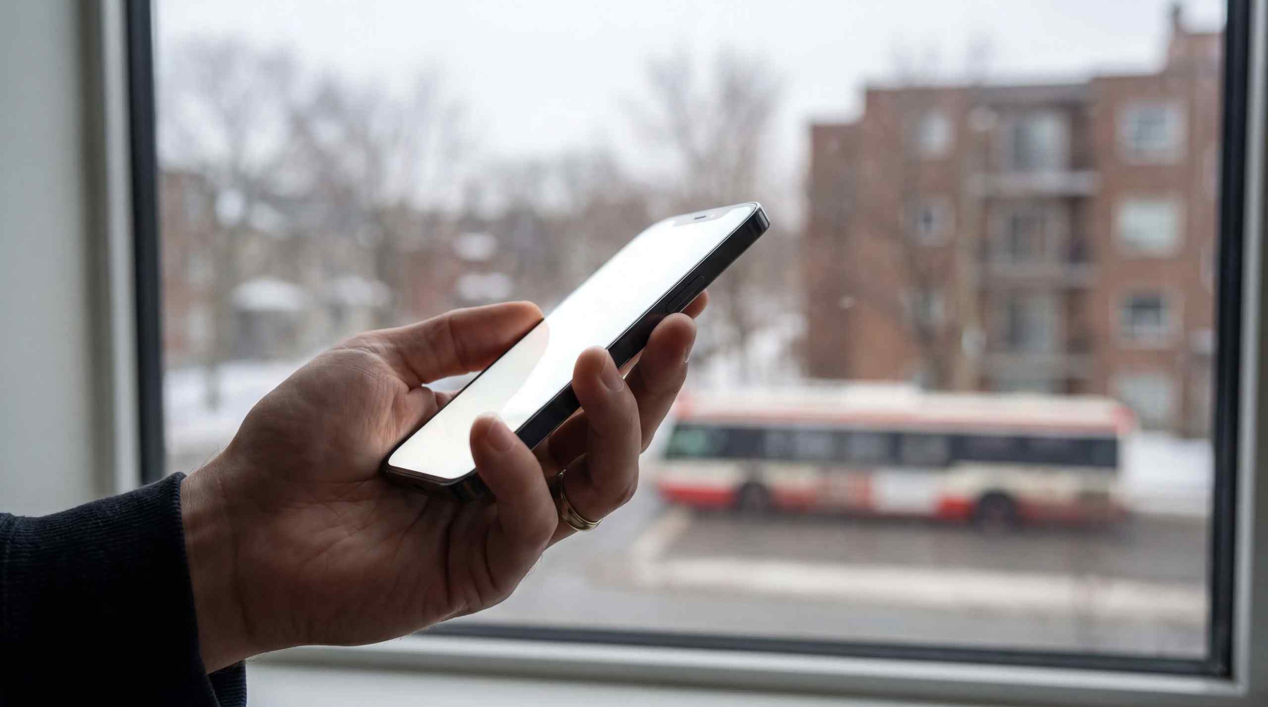 A smartphone with rain in the background.