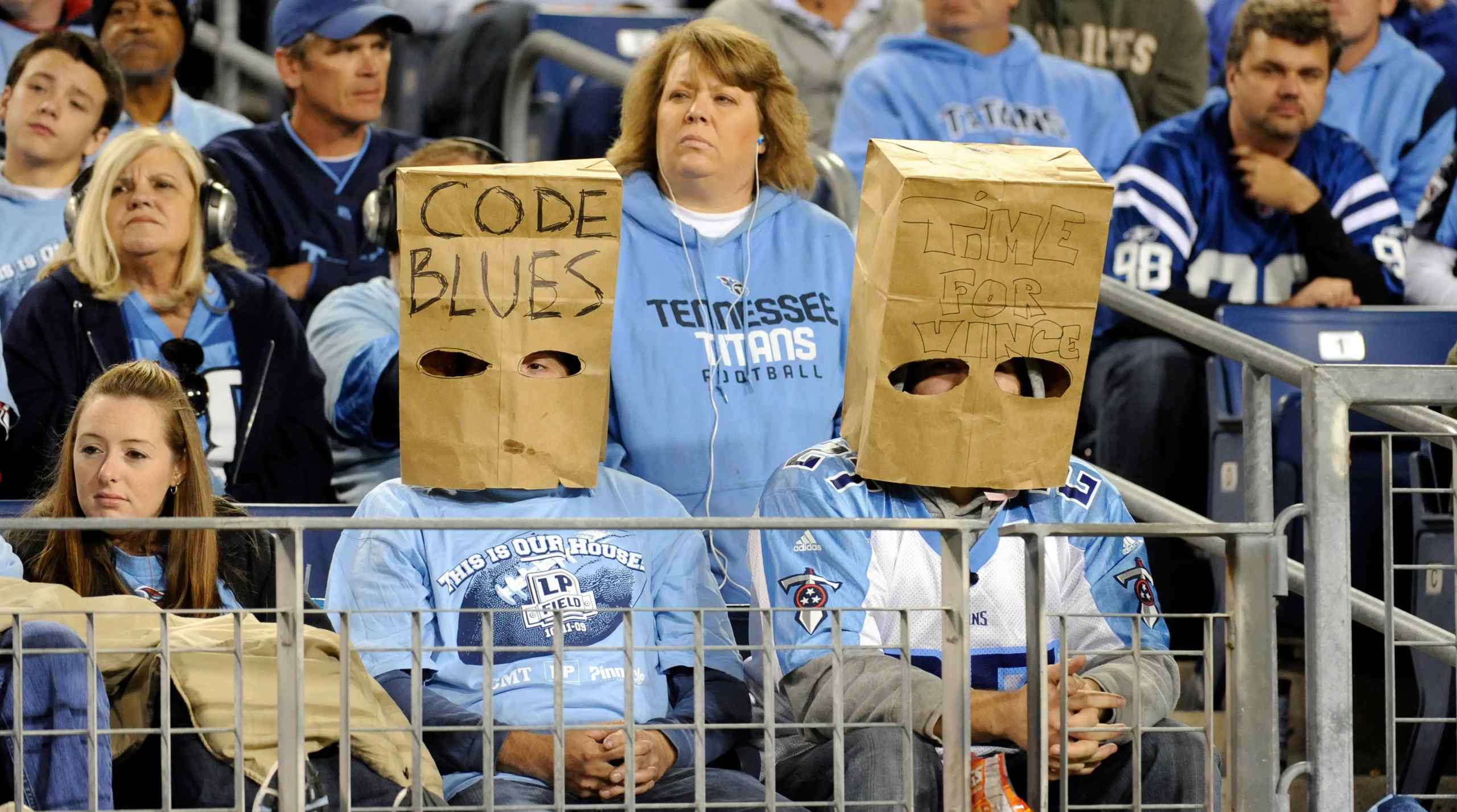 Tennessee Titans fans wearing garbage bags over their heads.