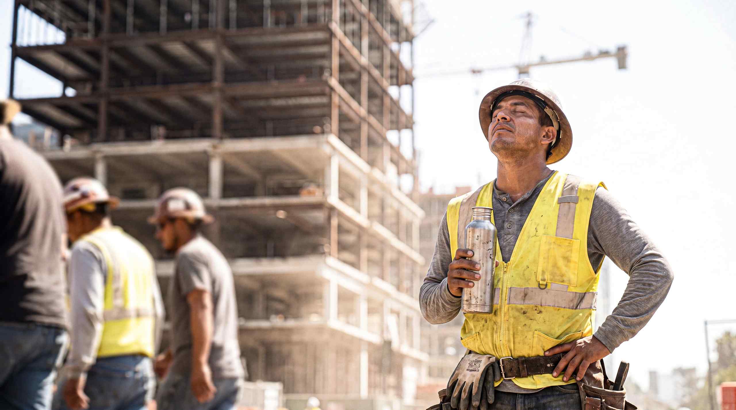 construction worker drinking water