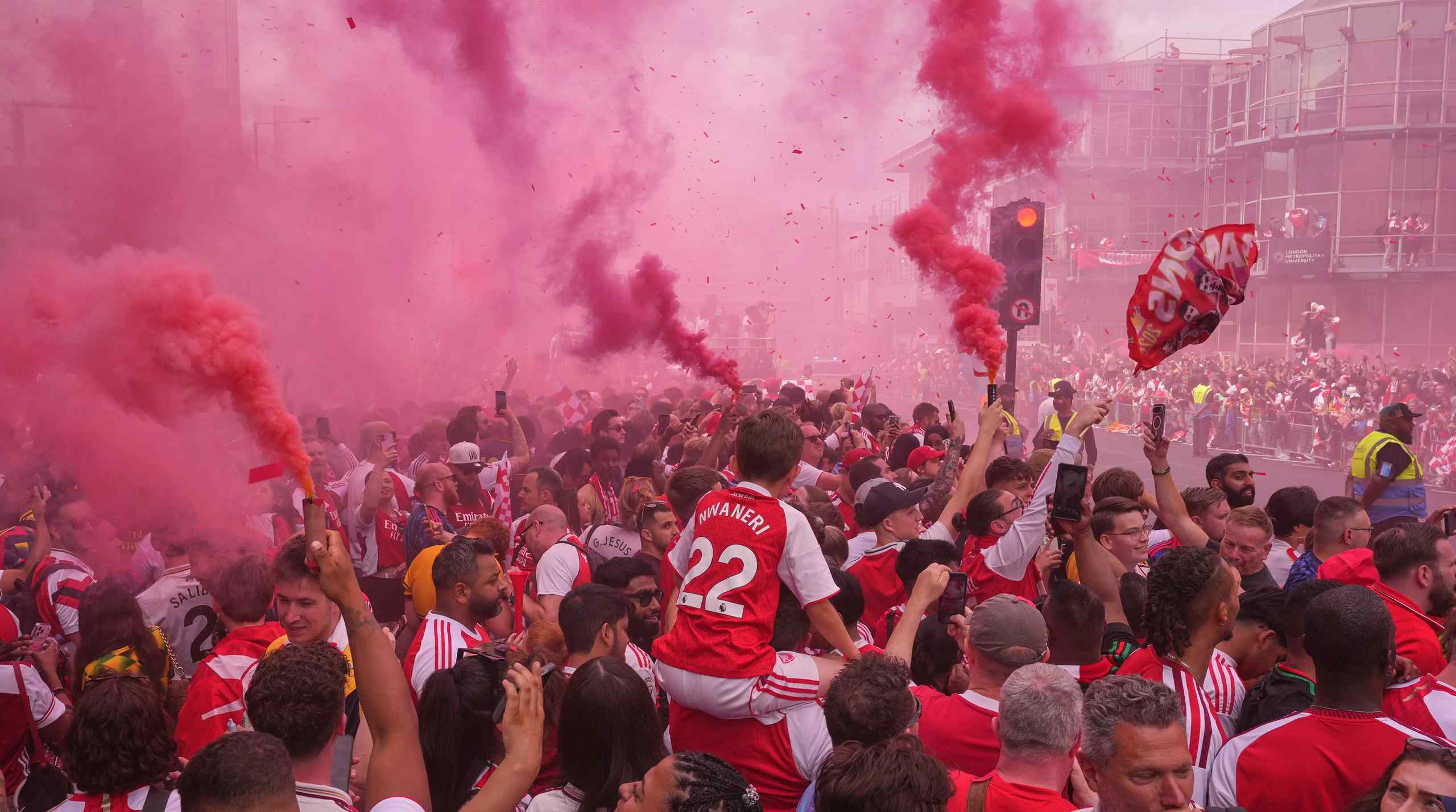 Fans celebrating Arsenal winning the Premier League in 2026.