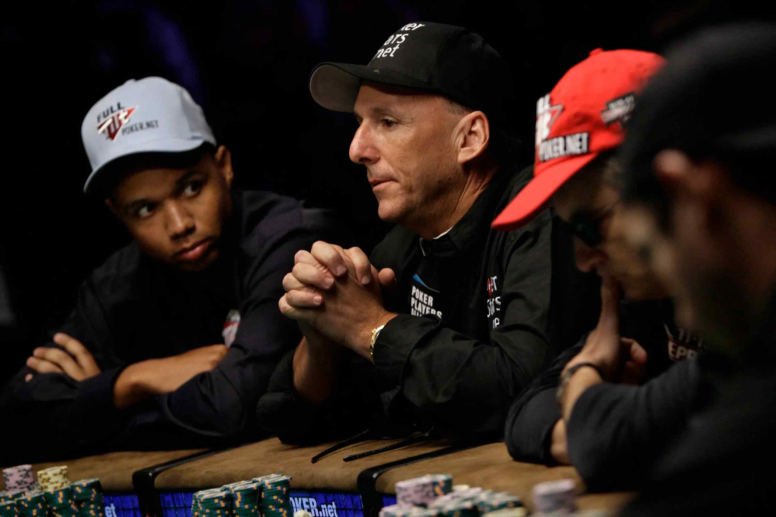 A photo of Phil Ivey and several other poker players at the World Series of Poker.