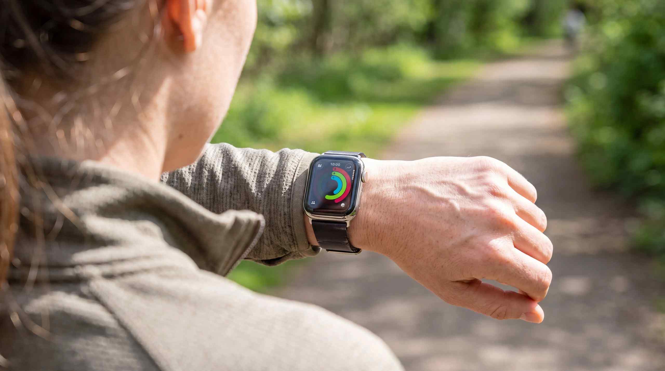 A man checking his health ring on an Apple Watch.