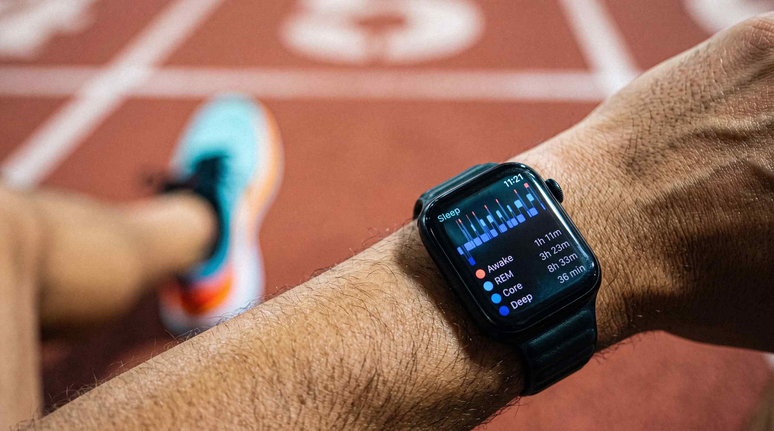 AI-generated image of an athlete examining their sleep score from their smart watch. 