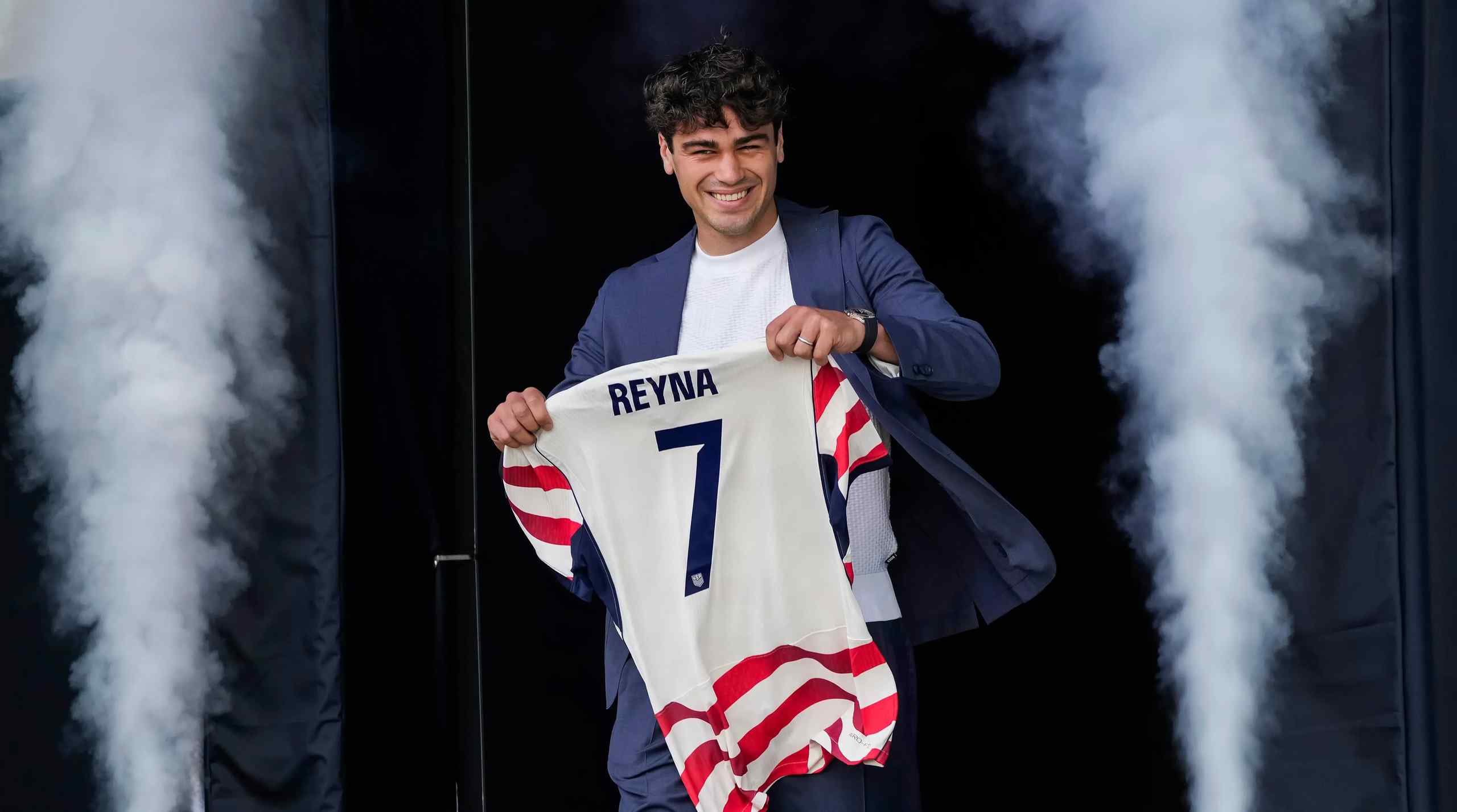 Gio Reyna holding his jersey