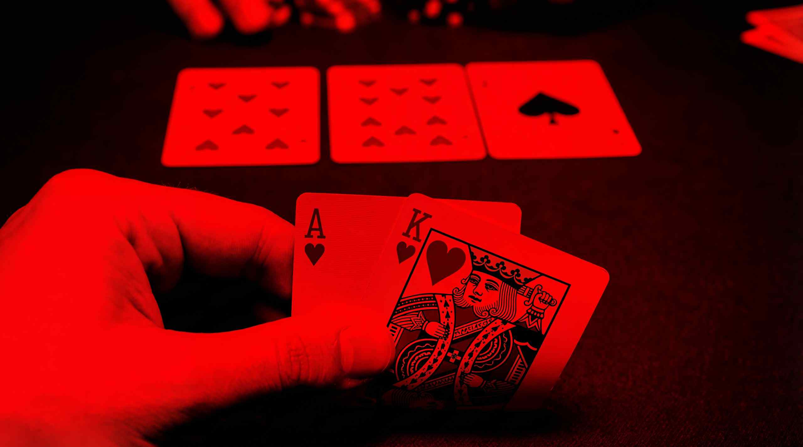 Great starting Texas Hold'em hand. Ace and King of Hearts. Two hearts are flopped along with the Ace of Spades. 