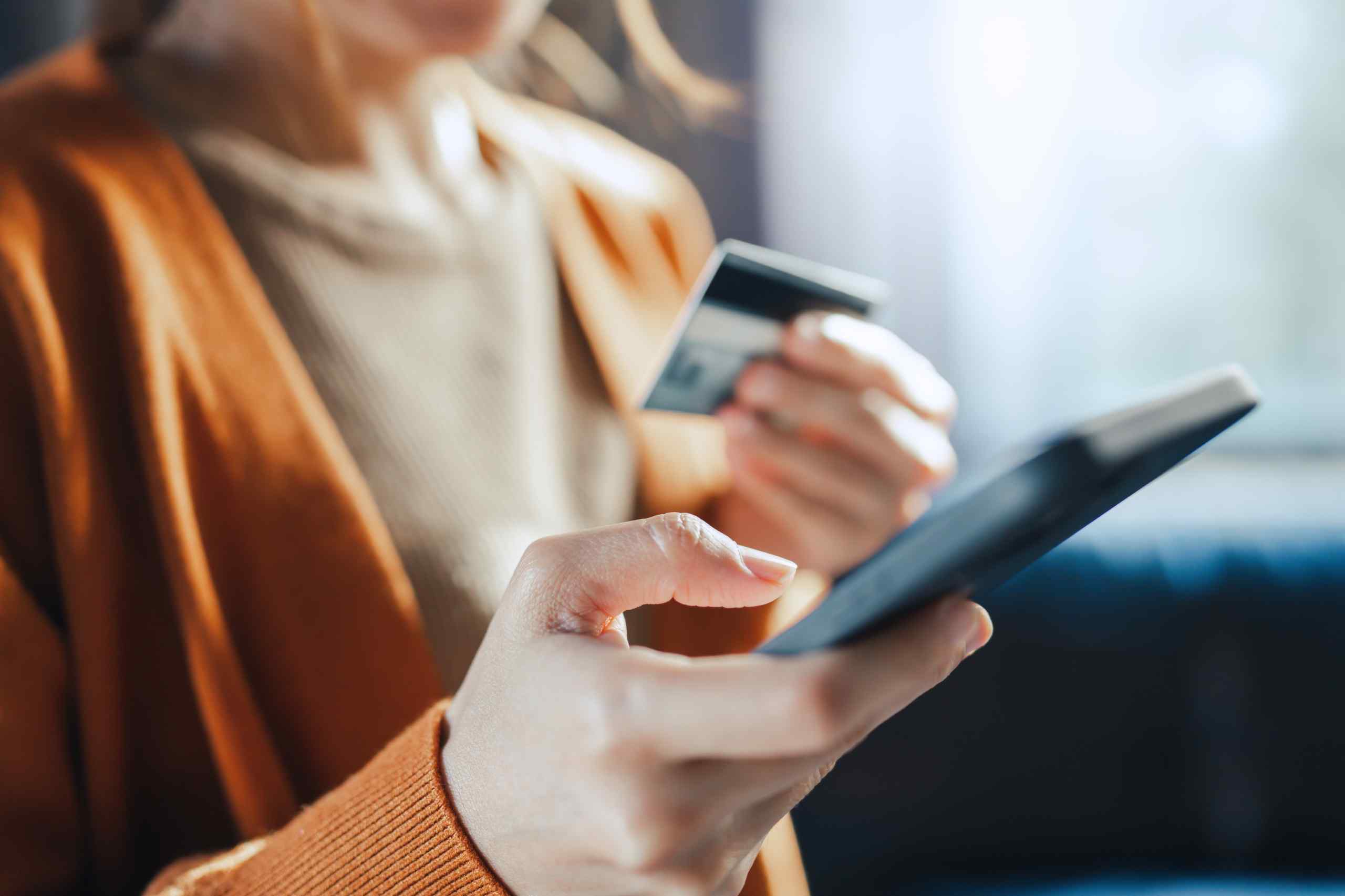 A woman on her phone concerned about her digital security.